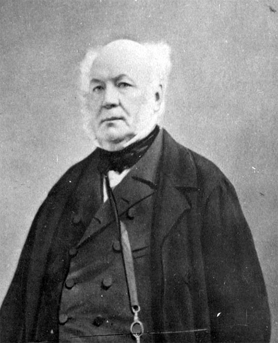 Mature man dressed formally for a portrait.