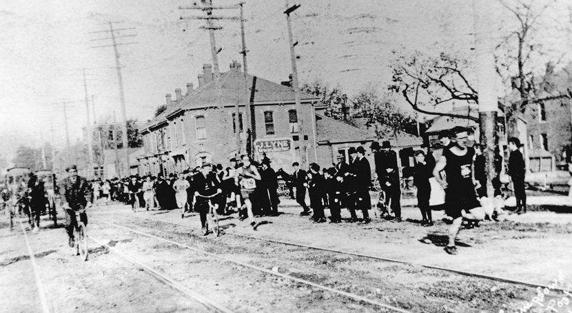 Participants and spectators along a section of the Around the Bay Road Race 1906.