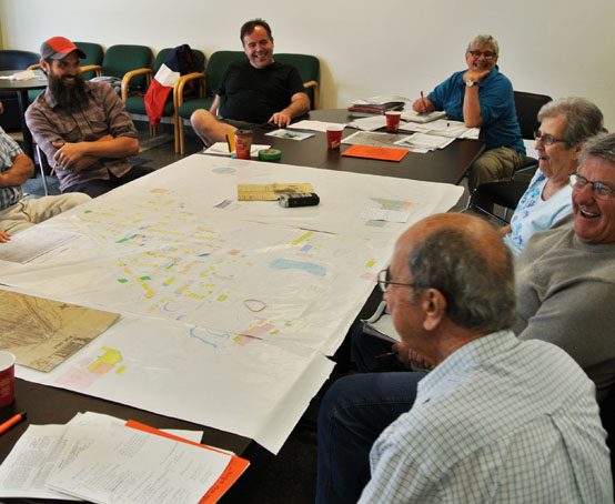 The Brightside Neighbourhood Project team gathered around the collaborative map.