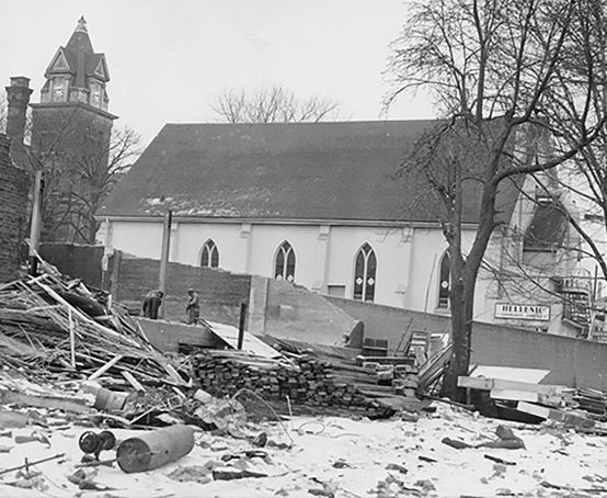 The white stucco, Gothic-windowed edifice and demolition site of the Beth Jacobs Synagogue.