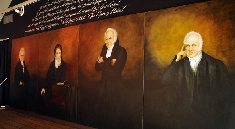 Four formal painted portraits of four men.