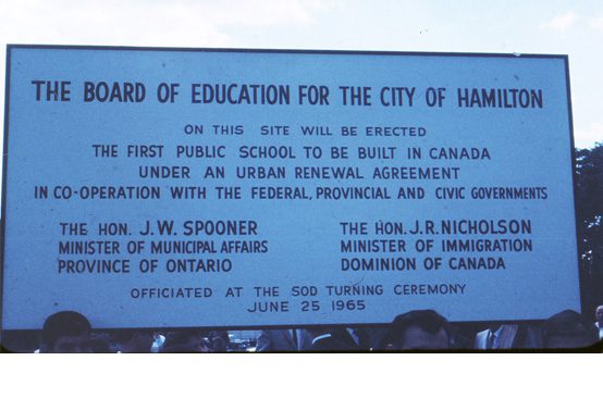 Construction site sign for the first public school built in Canada under an urban renewal agreement 1965.