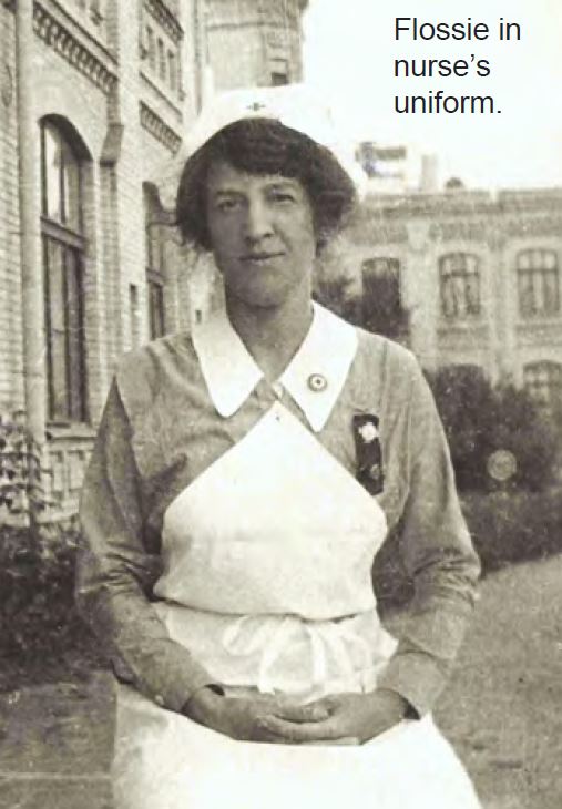 Woman wearing an older style of nurses' uniform.