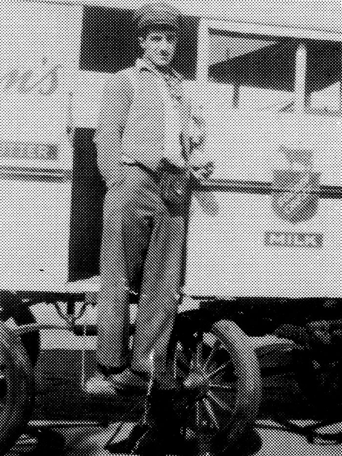 A man and his Borden’s horse-drawn milk wagon.