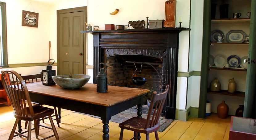 A typical early nineteenth century kitchen with fire place.
