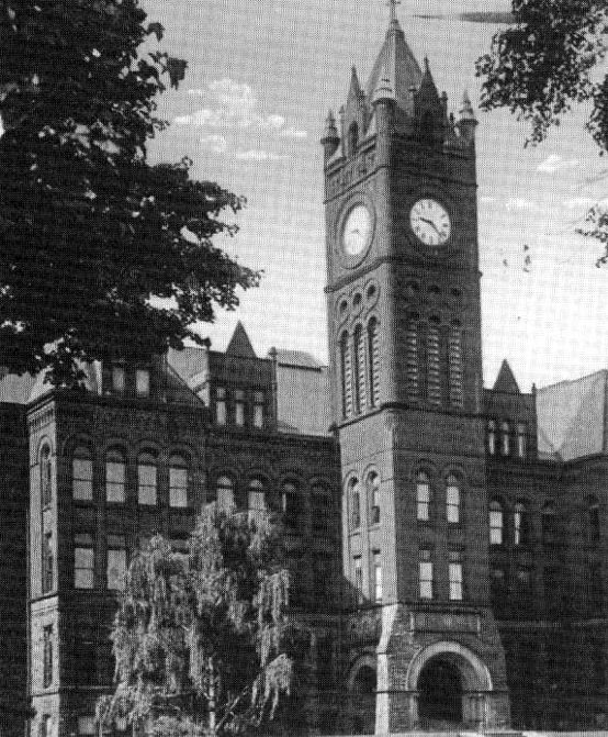 Close up of Central Collegiate Institute bell tower and facade in all its Romanesque architectural grandeur.