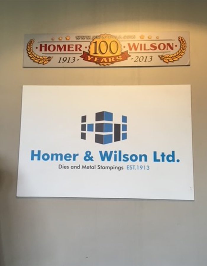 Homer & Wilson signs celebrate 100 years in 2013 .