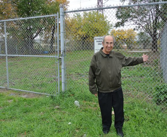 A man pointing to the area near his old home