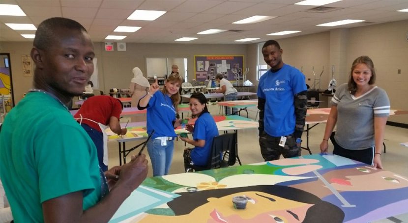 Journey of Hope mural volunteers in action.