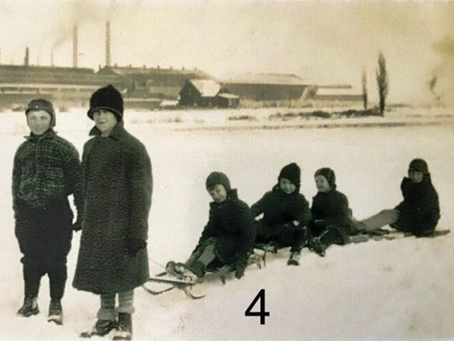 Kids on toboggans near the frozen Manchester Street inlet in winter 1930.