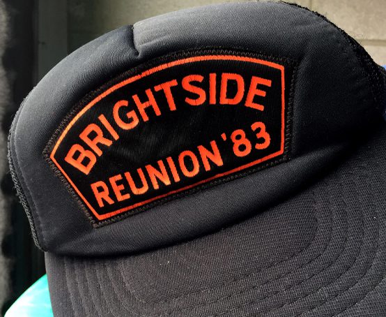 The Brightside Reunion of 1983 as stitched on a black visor hat.