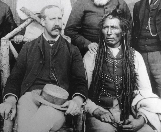 Close up of two men in a group photo.