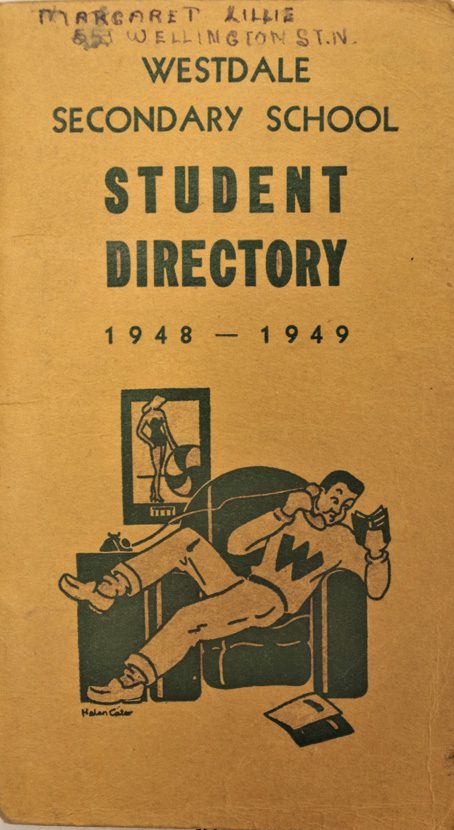 Westdale Secondary School student directory cover with image of lounging male student on phone.