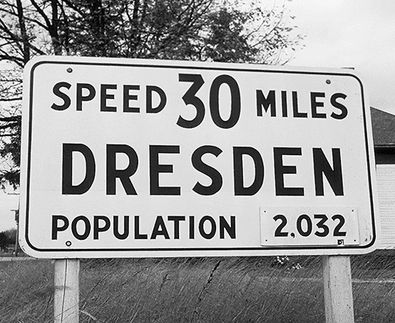 Town of Dresden road sign with speed and population.