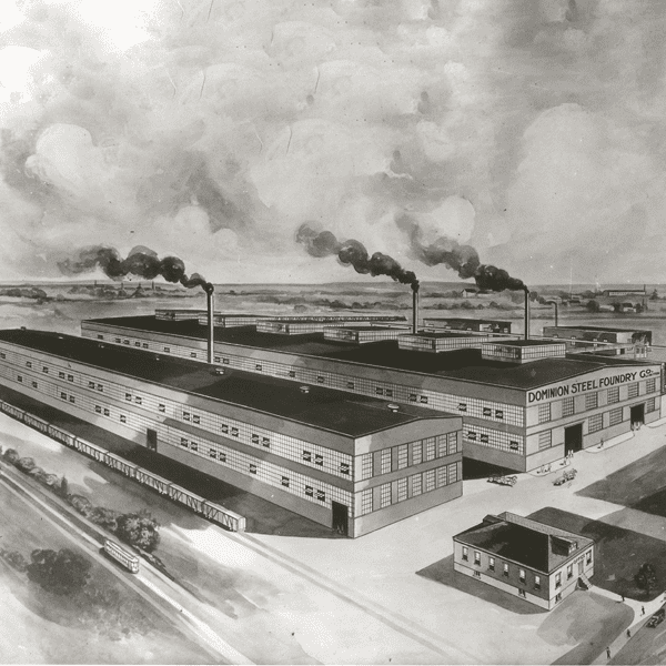 Black and white engraving of a large factory complex with a sign on one of the buildings that reads “Dominion Steel Foundry Co.” Smokestacks expel black plumes of smoke into the sky..