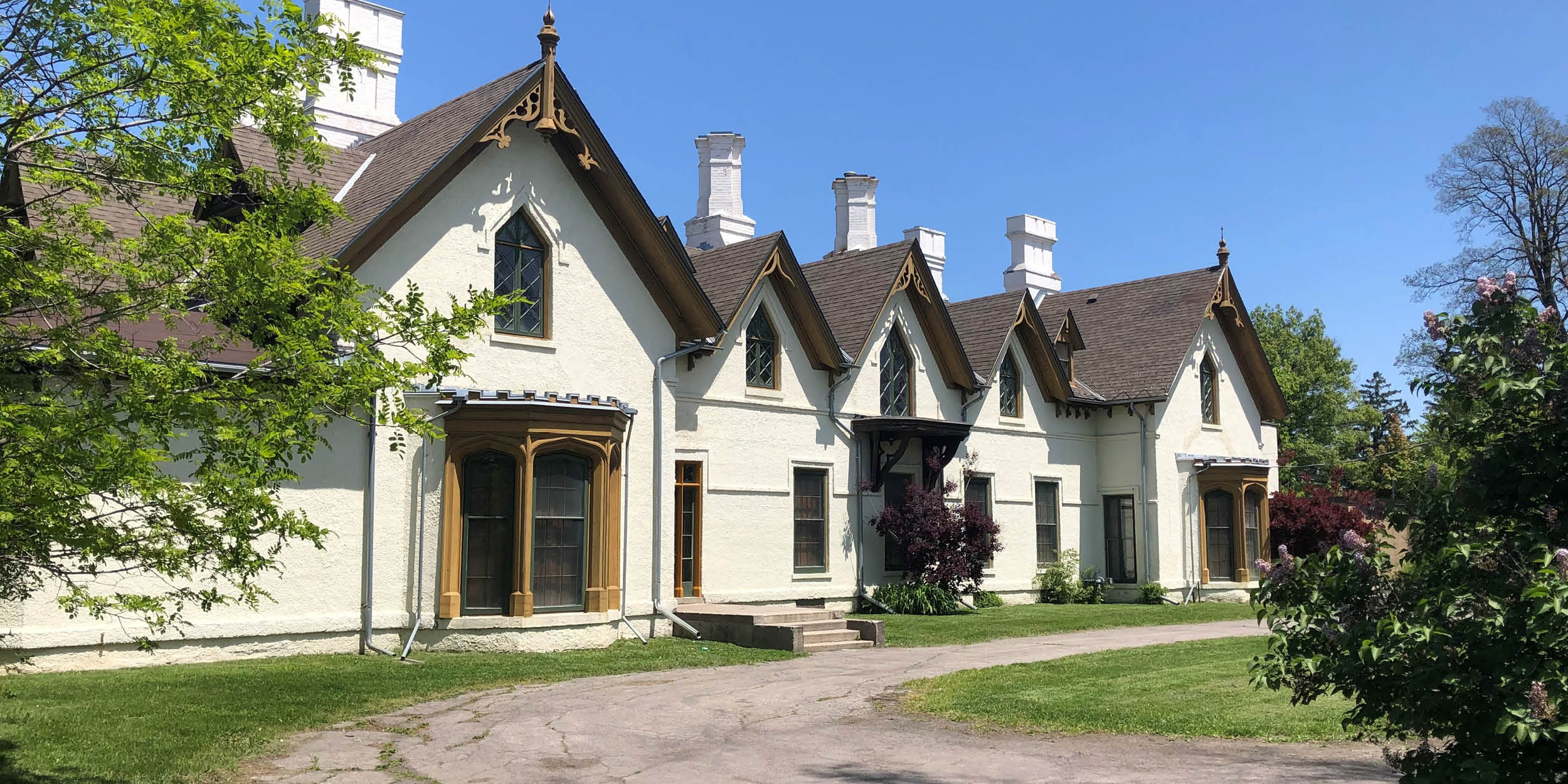 The white Gothic Revival manor house at Auchmar Estate on a sunny day