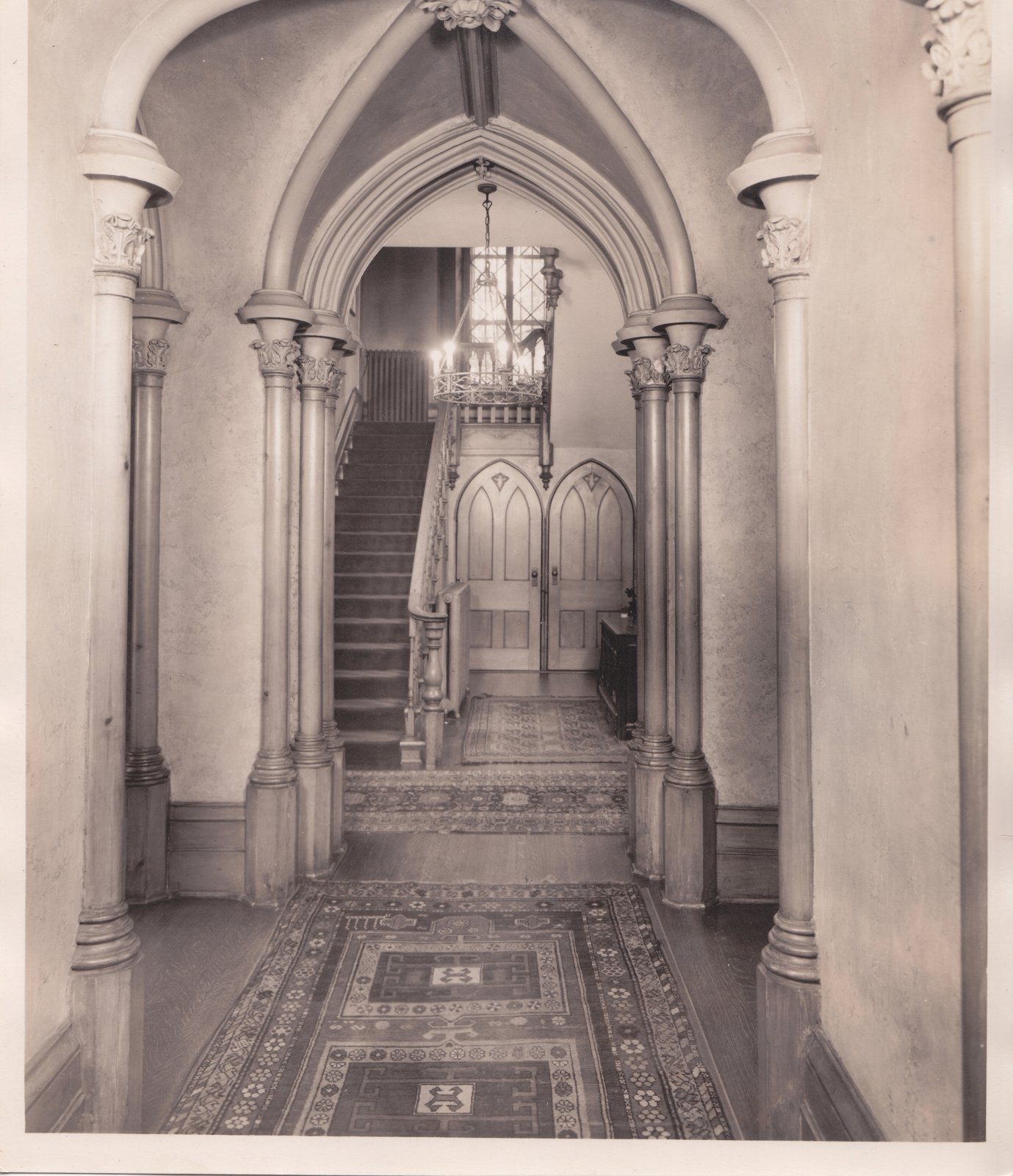 The main hall of Auchmar with its Gothic arches and staircase, facing west