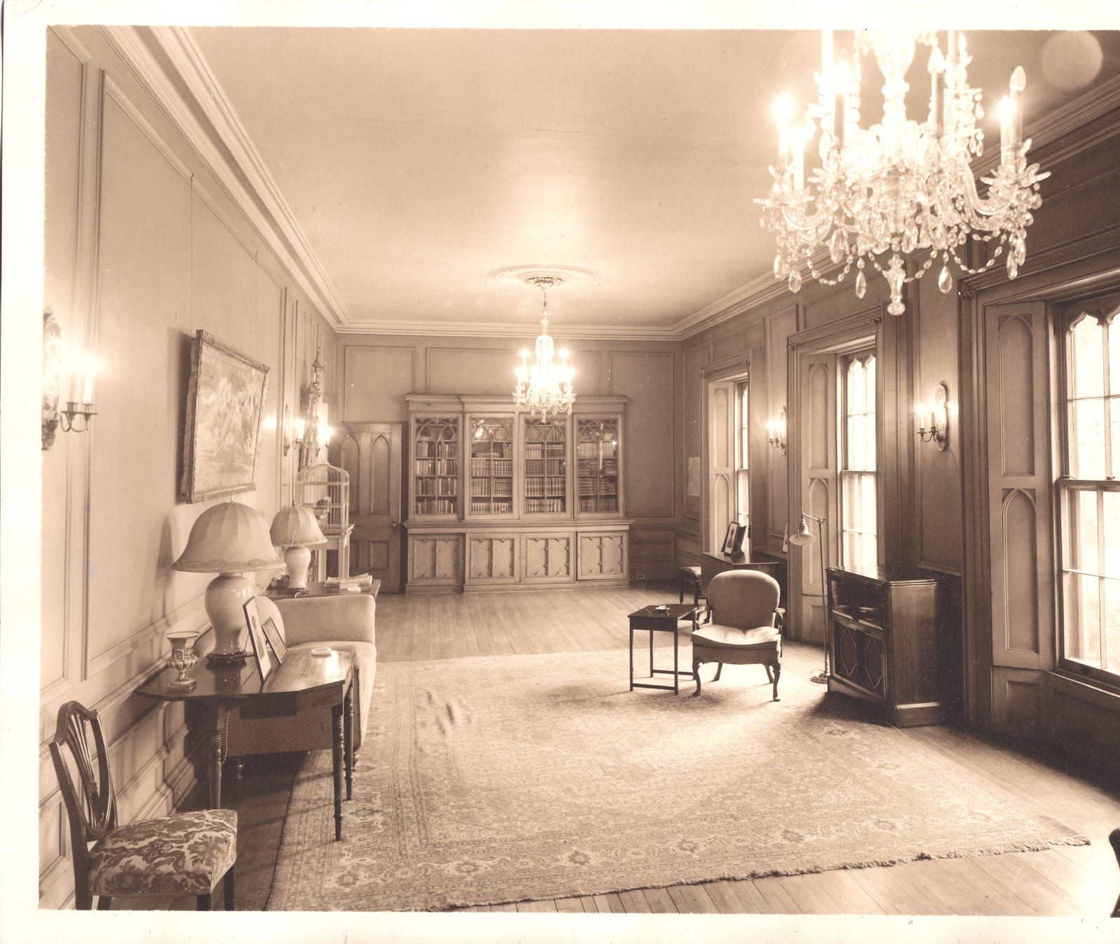 The parlour at Auchmar with chandeliers and panelled walls