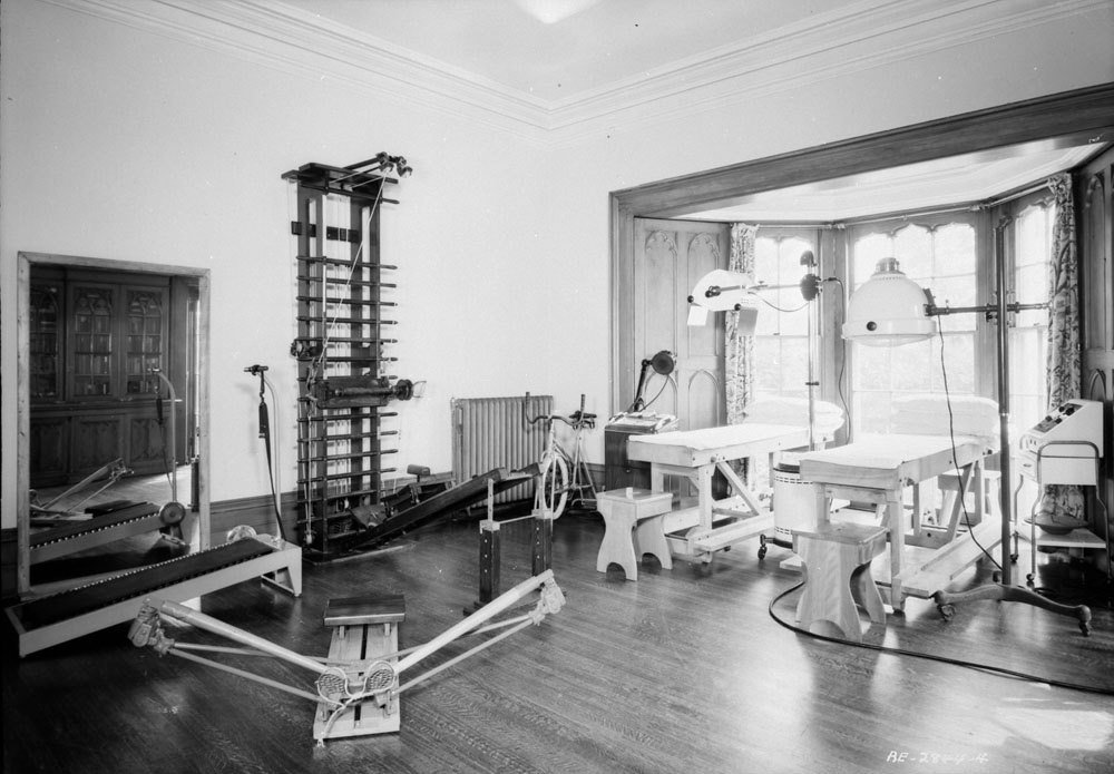 A room at Auchmar fitted with exercise and physical therapy equipment, 1940s